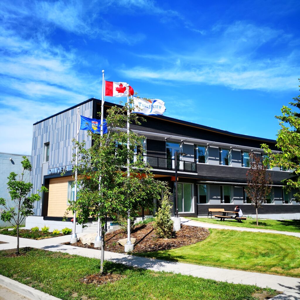 Valleyview Town Office Summer 2019 with flags photo by Adrian Petrilli